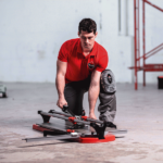 professional tiler using a Rubi TX tile cutter